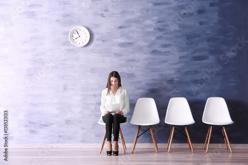 Young woman waiting for job...