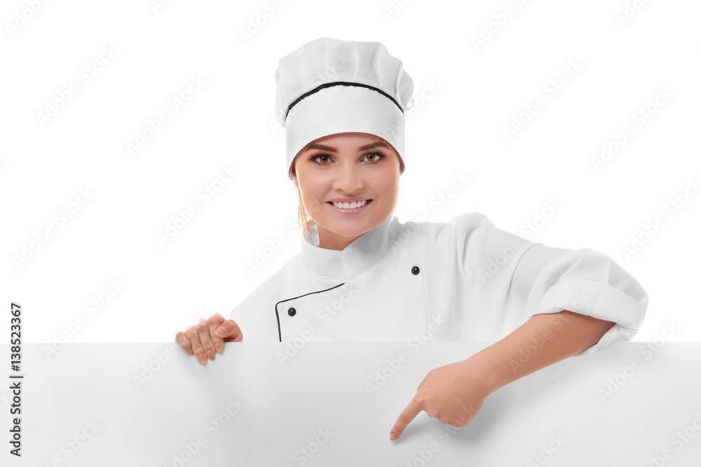Young woman chef holding white blank banner isolated on white background Young woman chef holding white blank banner isolated on white background