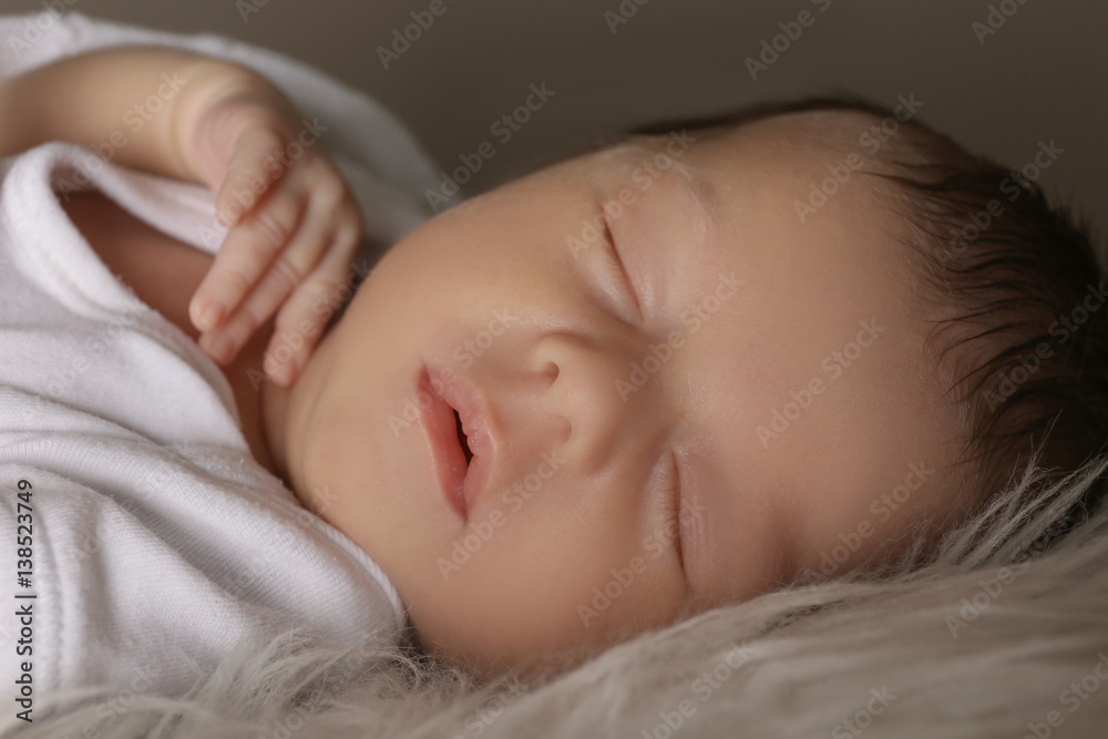 Cute little baby sleeping on soft plaid, closeup Cute little baby sleeping on soft plaid, closeup