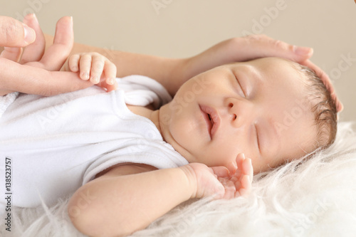 Cute sleeping baby with mot...