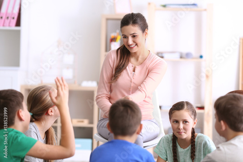 Female teacher conducting lesson at school