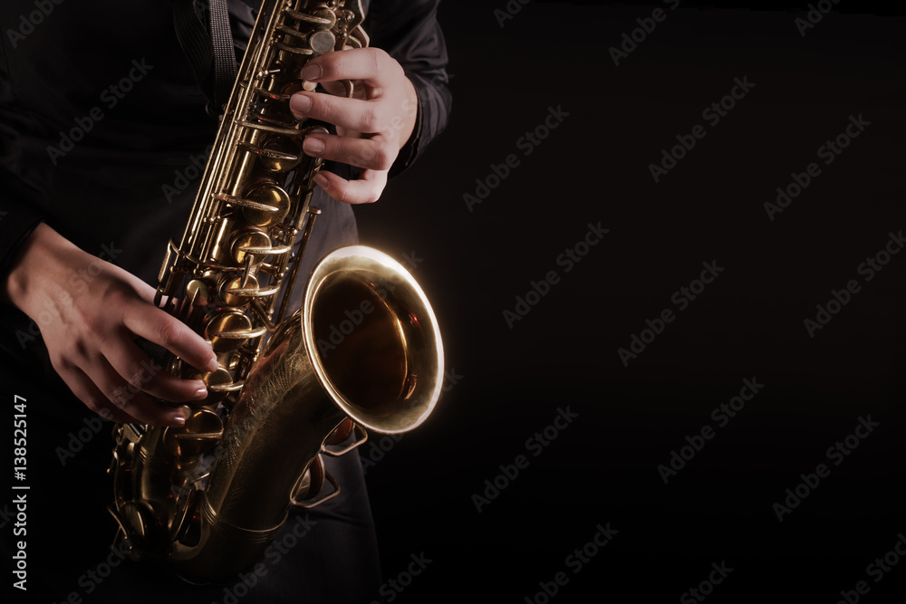 Fototapeta premium Saxophone player Saxophonist playing jazz music instruments