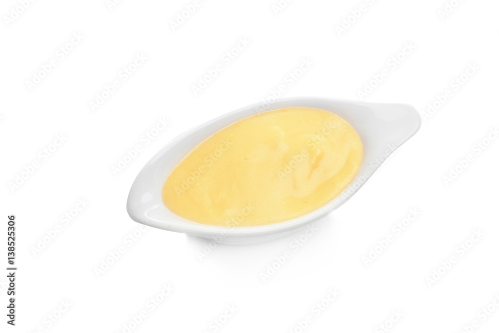 Sauceboat full of creamy cheese, isolated on white Sauceboat full of creamy cheese, isolated on white