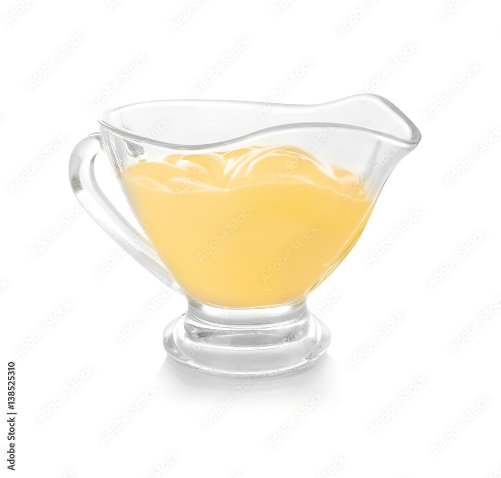 Sauceboat full of creamy cheese, isolated on white Sauceboat full of creamy cheese, isolated on white