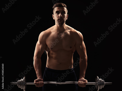 Sporty man doing exercises ...