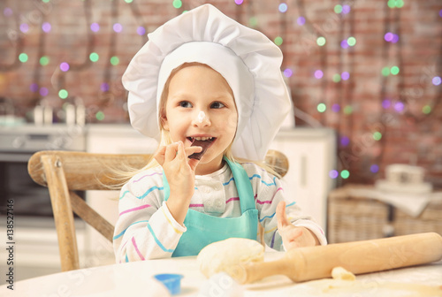 Little girl making biscuits...