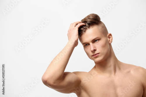 Handsome young man posing on white background