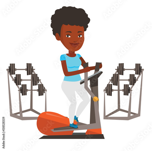 Woman exercising on elliptical trainer.