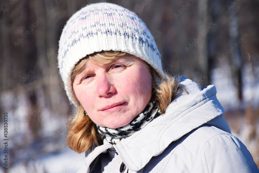 Tranquil mature woman with red nose and white hat Tranquil mature woman with red nose and white hat