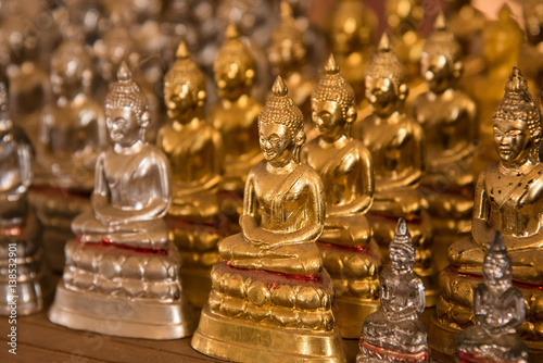 Little buddha statues in temple Thailand.
