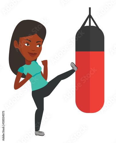 Woman exercising with punching bag.