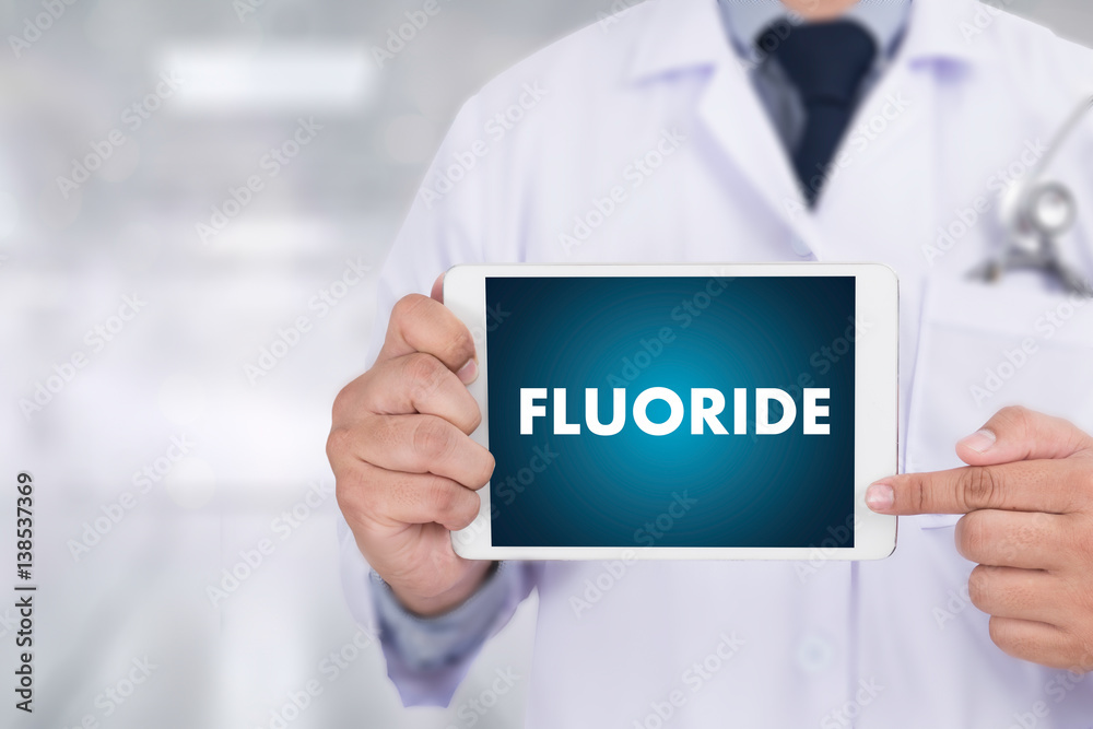 FLUORIDE Medicine doctor hand working Professional doctor use computer and medical equipment all around FLUORIDE Medicine doctor hand working Professional doctor use computer and medical equipment all around