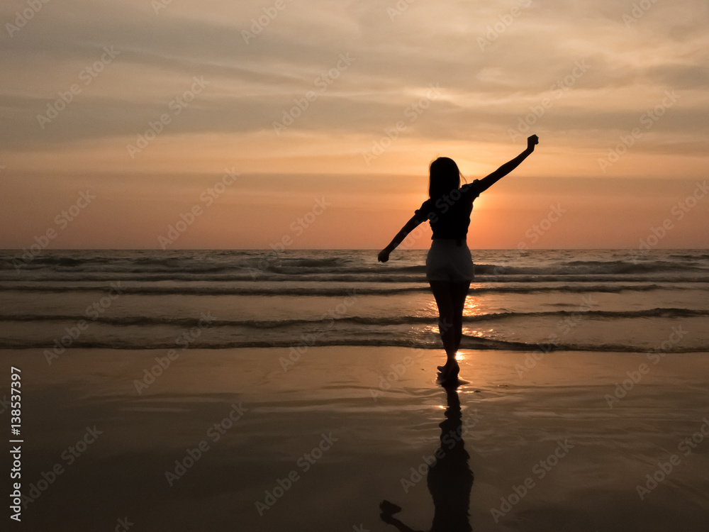 silhouette woman on the beach