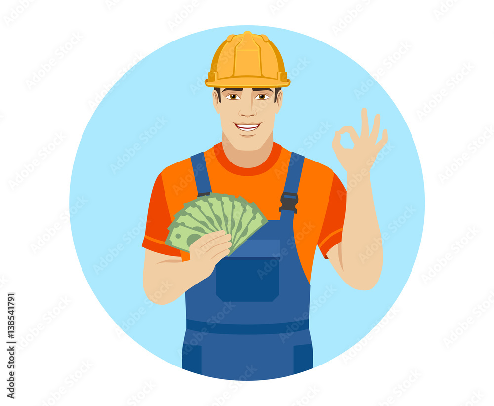 Builder with money show a okay hand sign Builder with money show a okay hand sign