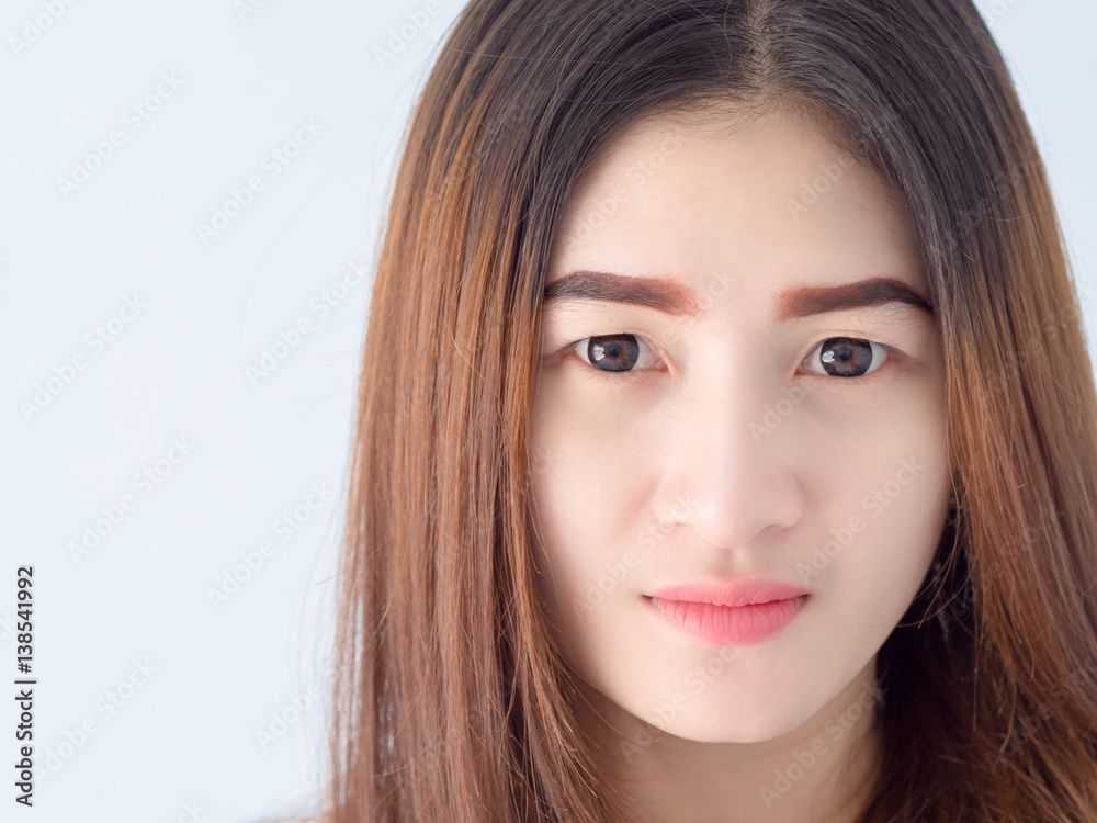 Portrait of Asian woman in white vest, expressing the idea of broken heart and sadness. hopeless and await, concept. Portrait of Asian woman in white vest, expressing the idea of broken heart and sadness. hopeless and await, concept.