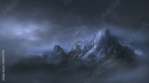 High mountain pass in dramatic misty atmosphere