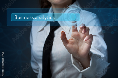 Business, technology, internet and networking concept. Business woman presses a button on the virtual screen: Business analytics