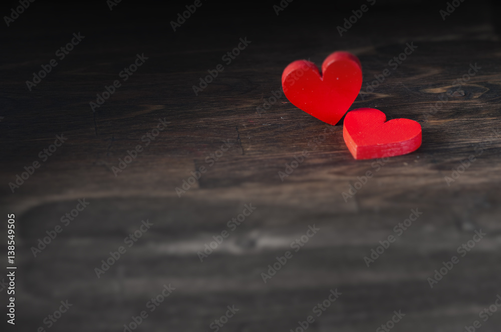 Fototapeta premium two hearts on dark wooden background