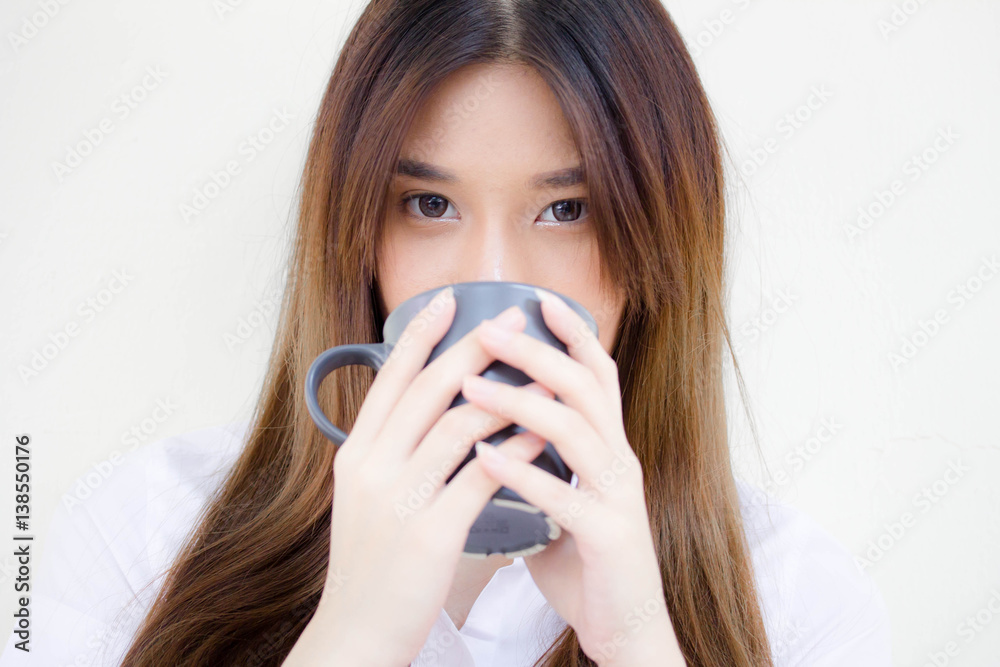 Portrait of thai adult student university uniform beautiful drinking coffee Portrait of thai adult student university uniform beautiful drinking coffee