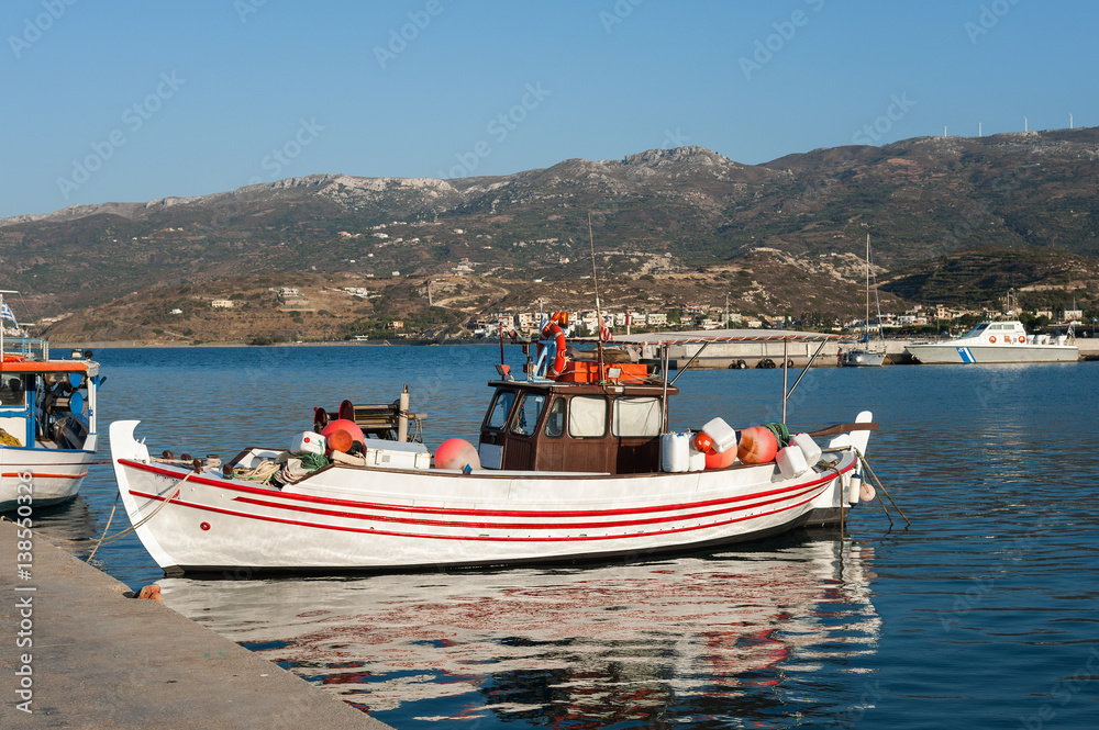 Traditional Greek fishing boats at harbor of Sitia town on eastern part of Crete island, Greece
