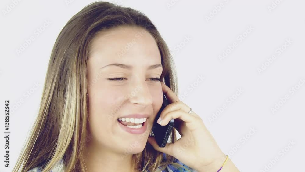 Happy blond teenager talking on the phone with boyfriend closeup Happy blond teenager talking on the phone with boyfriend closeup