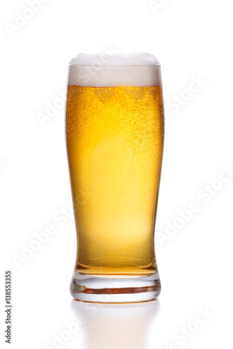 glass of light beer on white.