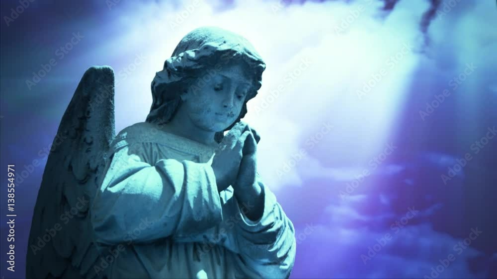 Angel 1009: The statue of an Angel on time lapse blue clouds (Loop).