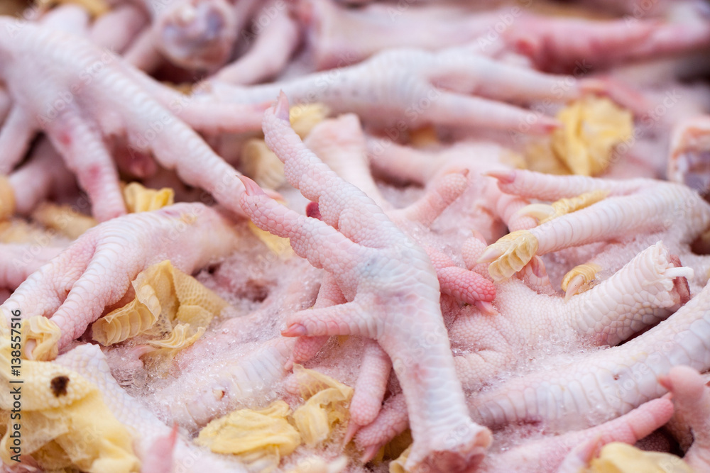 raw chicken paws sold on the market. Selective focus