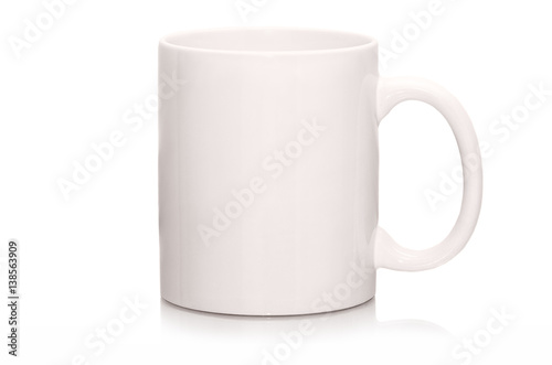 White mug empty blank for coffee or tea isolated on white background. White cap with shadow