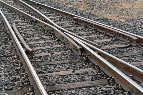 Railway junction perspective of crossing rails  - train tracks 