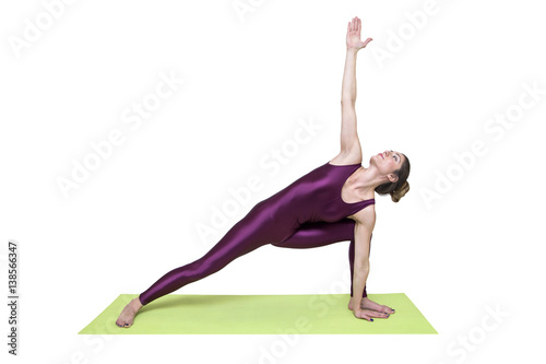 Young slim woman  practicing yoga in the studio