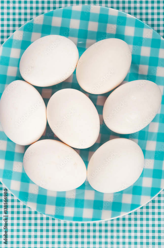 aquamarine green plate with white hen eggs aquamarine green plate with white hen eggs