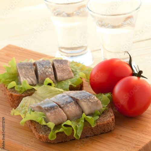 sandwich with herring and tomatoes photo