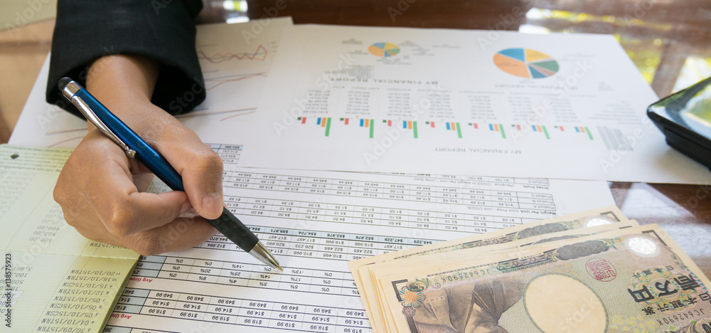 custom made wallpaper toronto digitalBusiness woman hand hold pen and on Statement or financial report and japan money in business concept