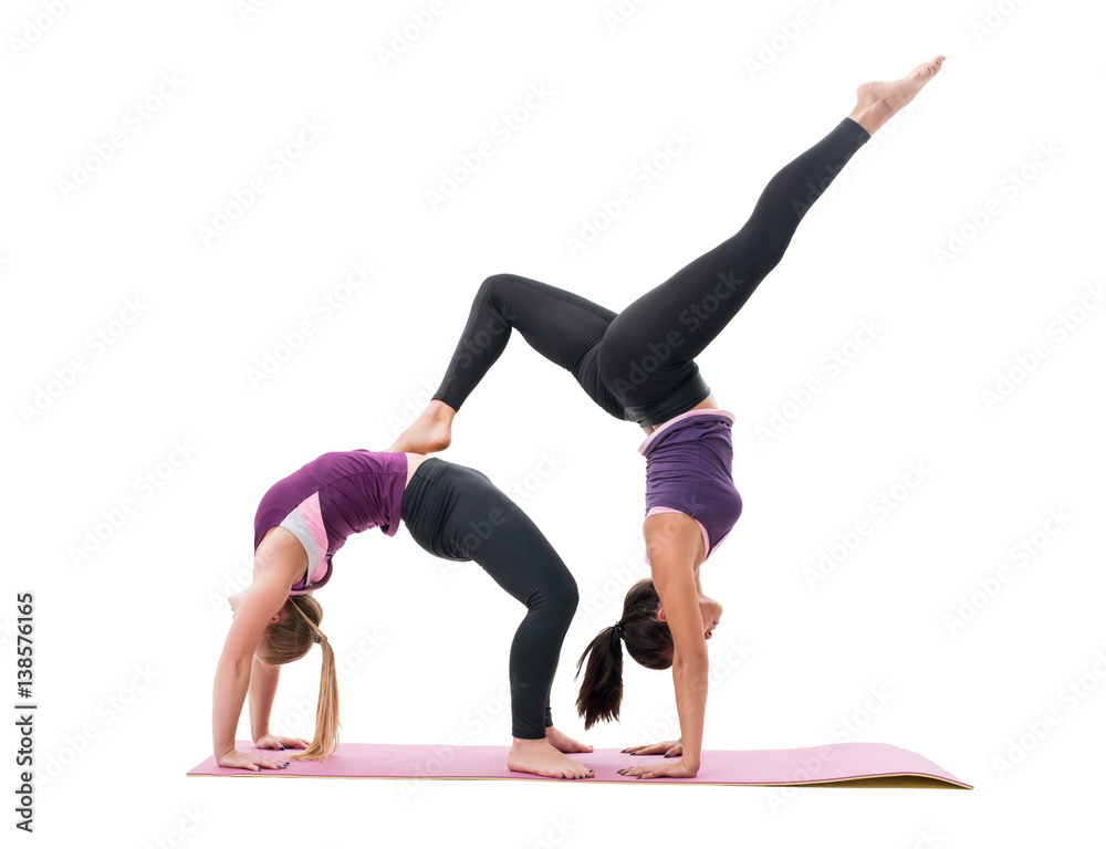 Sporty girls in violet tops and leggings in studio Sporty girls in violet tops and leggings in studio