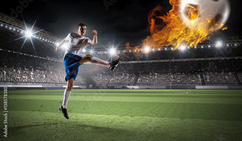 Soccer player at sport arena    . Mixed media © Sergey Nivens