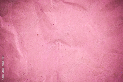 Pink crumpled recycle paper background.