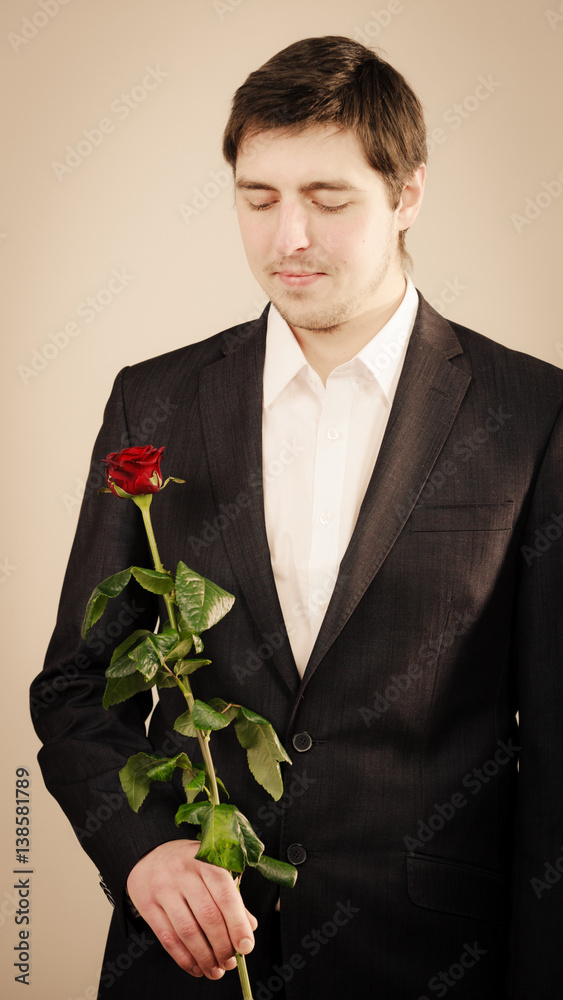Elegant young man with red rose. Elegant young man with red rose.