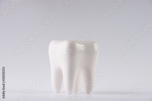 Lost tooth on isolated white background with copy space   Dental  medicine and health concept design element.