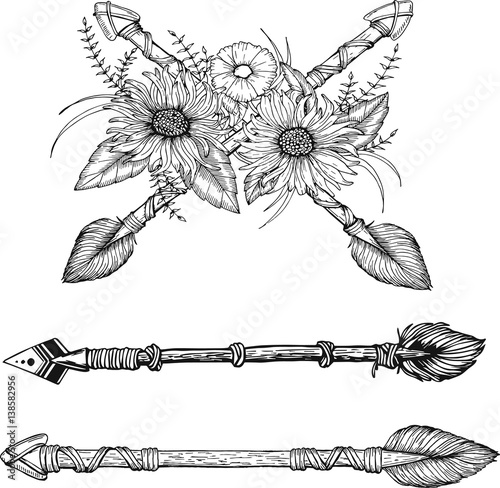 Tribal arrow set in ethnical pattern with feathers and wild flowers