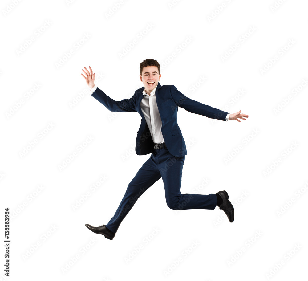 Young man jumping on white background 