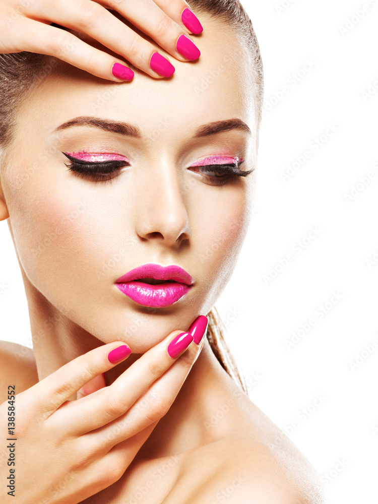 eautiful woman face with pink makeup of eyes and nails. eautiful woman face with pink makeup of eyes and nails.