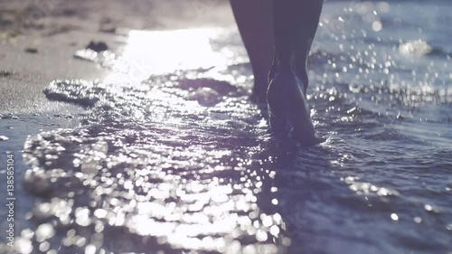 Foot stepping on the sea