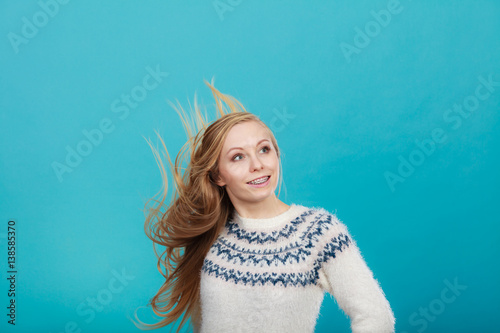 Crazy blonde woman with windblown blonde hair