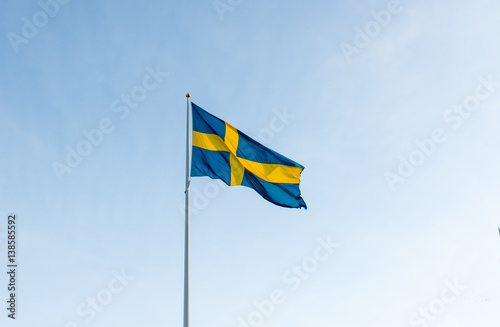 Svenska flaggan vajar i vinden 1/2 photo