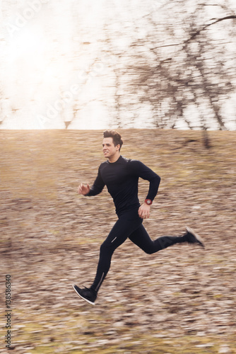 Young man running in the park 