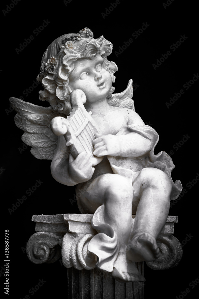 Statue of Little Cupid playing harp in black and white Statue of Little Cupid playing harp in black and white