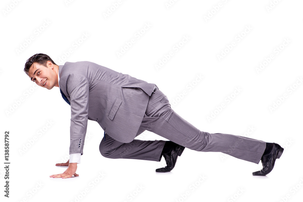 Businessman on start ready for running isolated on white Businessman on start ready for running isolated on white