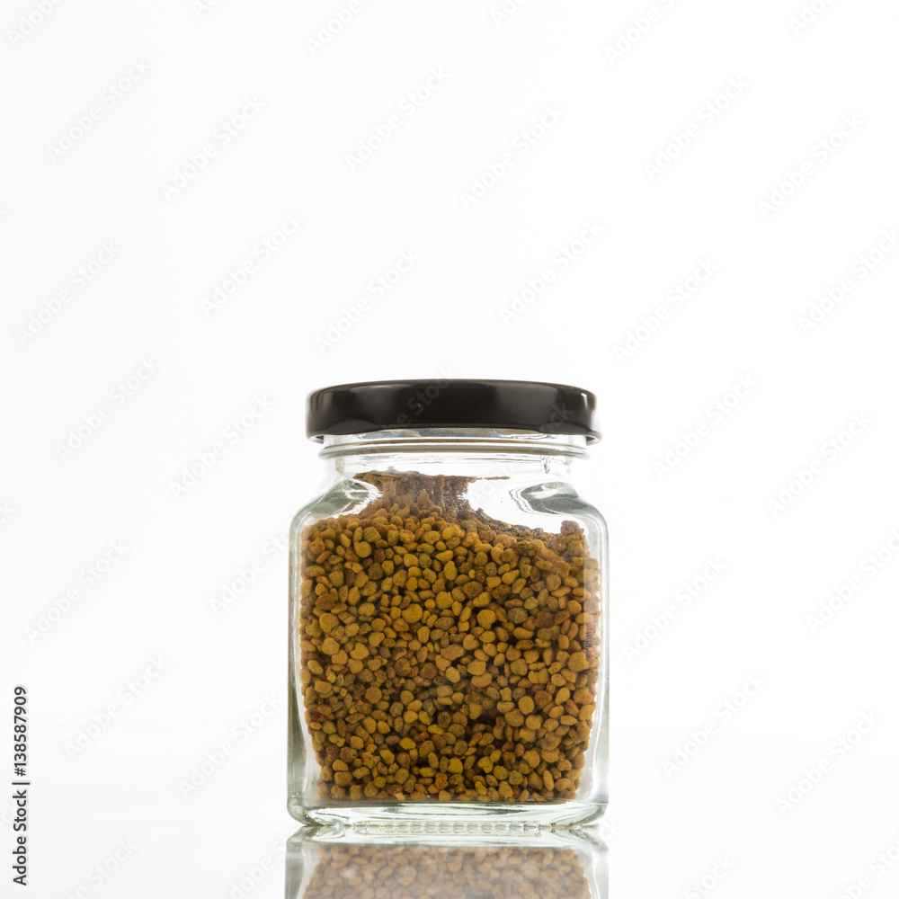 Close up jar of bee pollen isolated on white background. Close up jar of bee pollen isolated on white background.