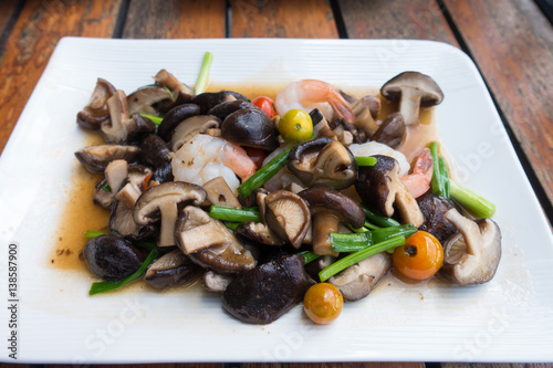 close up mushroom fried with shrimps.healthy food photo